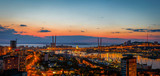 Fototapeta  - Panorama of the city of Vladivostok. Panoramic view of the Golden Horn and the central part of Vladivostok from one of the hills of the city at sunset time.