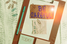 Text Sign Showing Be Careful. Business Photo Text Making Sure Of Avoiding Potential Danger Mishap Or Harm Clipboard Sheet Crushed Sticky Note Clip Notepads Marker Wooden Background