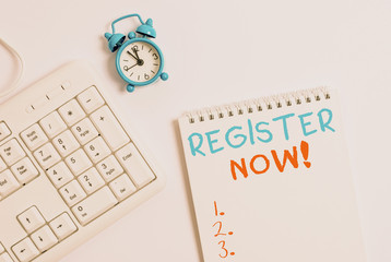 Writing note showing Register Now. Business concept for official list or record showing or things into web or forum Keyboard with empty note paper and pencil white background
