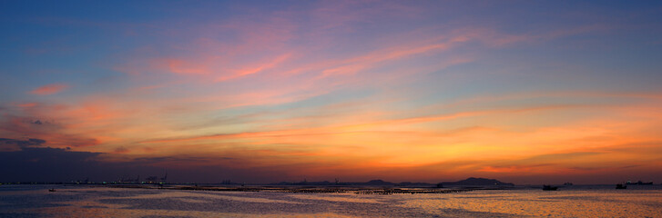 Panoramic view of dramatic twilight sky at sea with Si chang island background