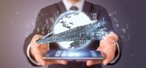 Poster - Businessman holding an Optical fiber connection - 3d rendering