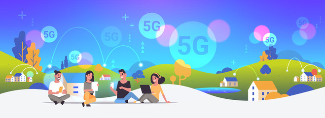 Poster - people using digital devices 5G online wireless system connection internet communication concept men women sitting outdoor countryside background full length horizontal vector illustration