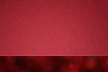 Wall Mural - Closeup textured red paper with Christmas red bokeh. Macro. 
