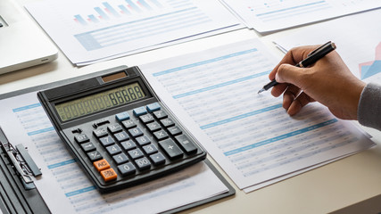 Poster - businessman working calculate data document graph chart report marketing research development planni