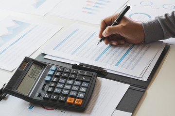Poster - businessman working calculate data document graph chart report marketing research development planni