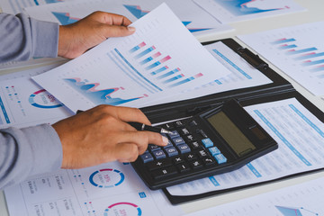 Poster - businessman working calculate data document graph chart report marketing research development planni