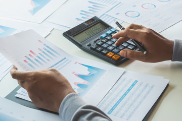 Poster - businessman working calculate data document graph chart report marketing research development planni