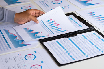 Poster - businessman working calculate data document graph chart report marketing research development planni