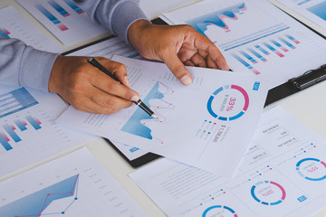Poster - businessman working calculate data document graph chart report marketing research development planni