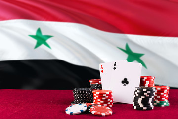 Syria casino theme. Aces in poker game, cards and chips on red table with national flag background. Gambling and betting.