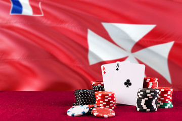 Wallis And Futuna casino theme. Aces in poker game, cards and chips on red table with national flag background. Gambling and betting.