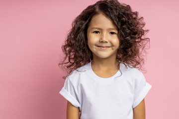 portrait of a pretty curly little girl
