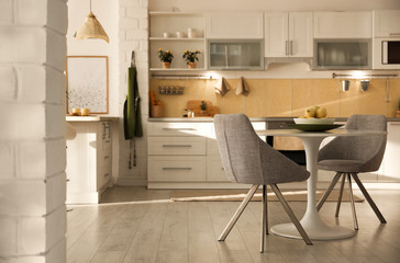 Poster - Modern kitchen interior with stylish white furniture. Space for text