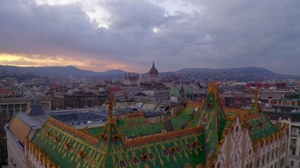 Wall Mural - Amazing roof in Budapest, Hungary. State Treasury building with Hungarian Parliament in winter time.  All tiles on the roof made from the world famous Zsolnay pyro granite.