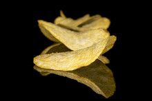 Lot Of Whole Crisp Potato Chip Isolated On Black Glass