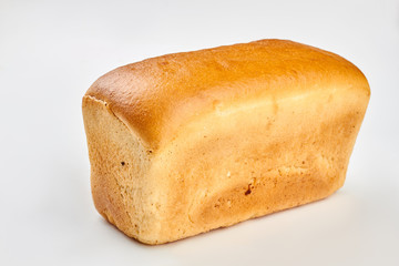 Square bread loaf on white background. Traditional freshly baked bread.