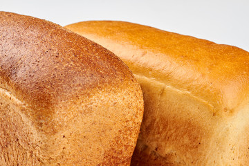 Close up freshly baked bread loaves. Delicious homemade bread background.