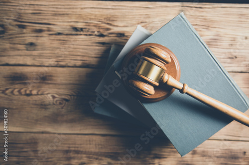 Fotomural wooden judge on books on the desk