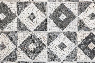 Geometric mosaic made from stone. Antique pattern.