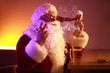 Funny drunk Santa Claus with cigar and mug of beer in pub