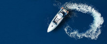Aerial Drone Ultra Wide Top Down Photo Of Luxury Rigid Inflatable Speed Boat Cruising In High Speed In Aegean Deep Blue Sea, Greece