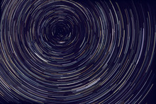 Star Trails -  Light Streaks Of Stars Around Polaris In The Night Sky Due To Earth's Rotation