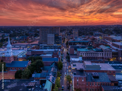 Cuadros en Lienzo Downtown area in dramatic sunset, aerial view of Lancaster, Pennsylvania