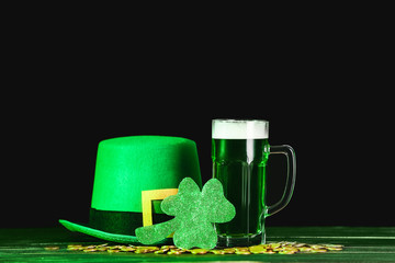 Green beer and Leprechaun's hat on table. St. Patrick's Day celebration