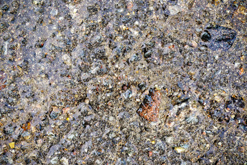 detailed close up view on asphalt on an old street in northern europe