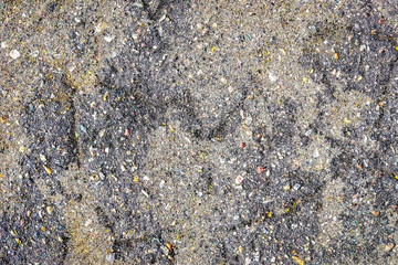 detailed close up view on asphalt on an old street in northern europe