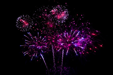 Colorful fireworks on black background for winter and new year festivals.