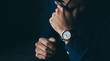 looking at luxury watch on hand check the time concept for managing time organization working,punctuality,appointment.fashionable wearing stylish
