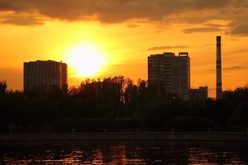 Wall Mural - Houses silhouette in Moscow urban landscape on beautiful evening sunset background