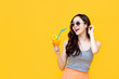 © Atstock Productions - Healthy Asian girl in summer outfit drinking orange juice