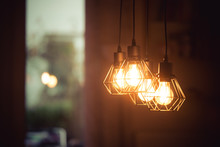 Lightning Lamps At Home, In Restaurant Or Cafe: Close Up Of A Hanging, Orange Lightbulbs