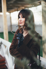 Wall Mural - Beautiful stylish woman posing on city street.