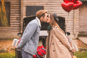 Sticker - Happy young couple near car outdoors. Valentine's Day celebration