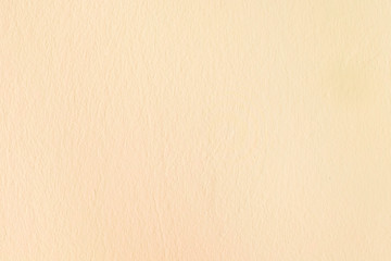 Beige concrete wall texture background. Clean interior wall paint on stucco coated cement wall.