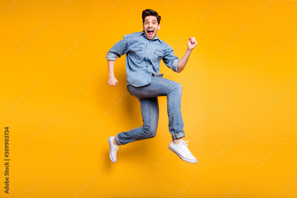 Turned full length body size photo of cheerful positive crazy man urgent for sales and discount in white sneakers denim isolated vivid color background - obrazy, fototapety, plakaty 