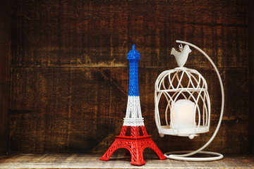 Eiffel tower statue with space copy on wooden background