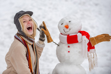 Love winter. Sensual winter girl posing and having fun. Girl in snow. Winter scene with happy people on white snow background.