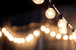 © NoonVirachada - blurred, Lamps hanging with bokeh background.