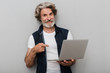 © Drobot Dean - Portrait of a handsome stylish mature man wearing a vest