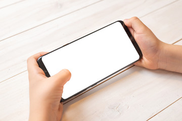 Aufkleber - Smart phone mockup in kid hands in horizontal position. Isolated screen in white for promote game or mobile app