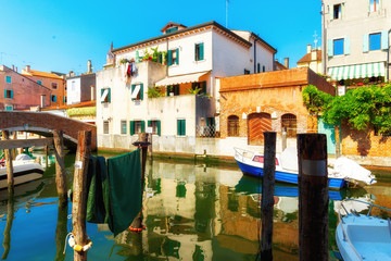 Venice, Italy. Traditional canal street with gondolas and boats