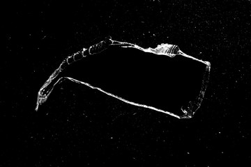 Aufkleber - hole in the glass with cracks isolated on a black background.