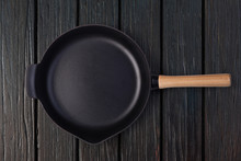 Empty Frying Pan On Wooden Background