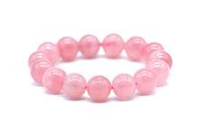 Rose Quartz Bracelet On White Background. The Love Magnet, Unconditional Love, Forgiveness And Compassion Crystal Gemstone.