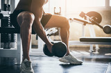strong athlete man person exercising in the sport gym, workout exercise training in fitness for body strong and fit, bodybuilding and healthy lifestyle people