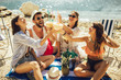 © Mediteraneo - Young friends having fun at the beach on a sunny day. Party time.